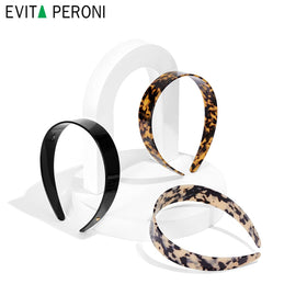 EVITA PERONI on model with formal updo showing elegant event-ready look