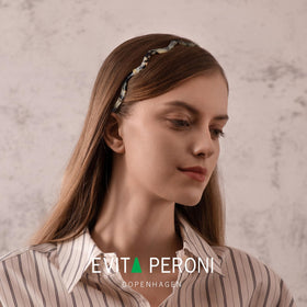 EVITA PERONI side profile displaying band clearing glasses temples for comfort