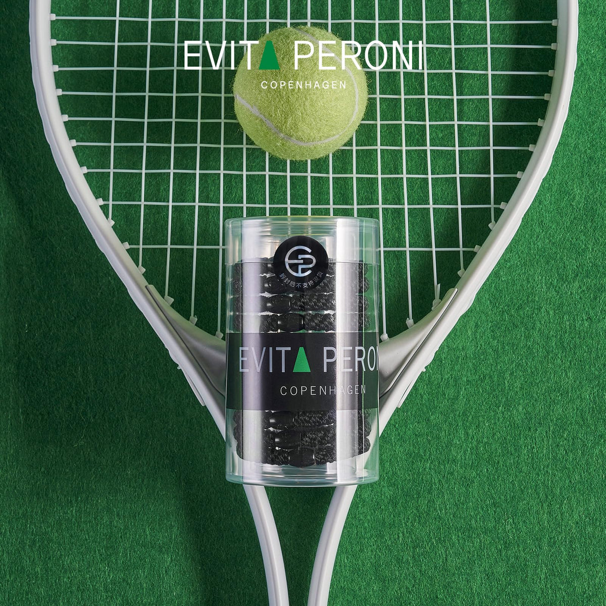 EVITA PERONI next to a ruler for size and scale to show 0.3 inch width