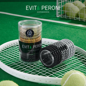 EVITA PERONI size comparison in hand illustrating compact, travel-friendly pack