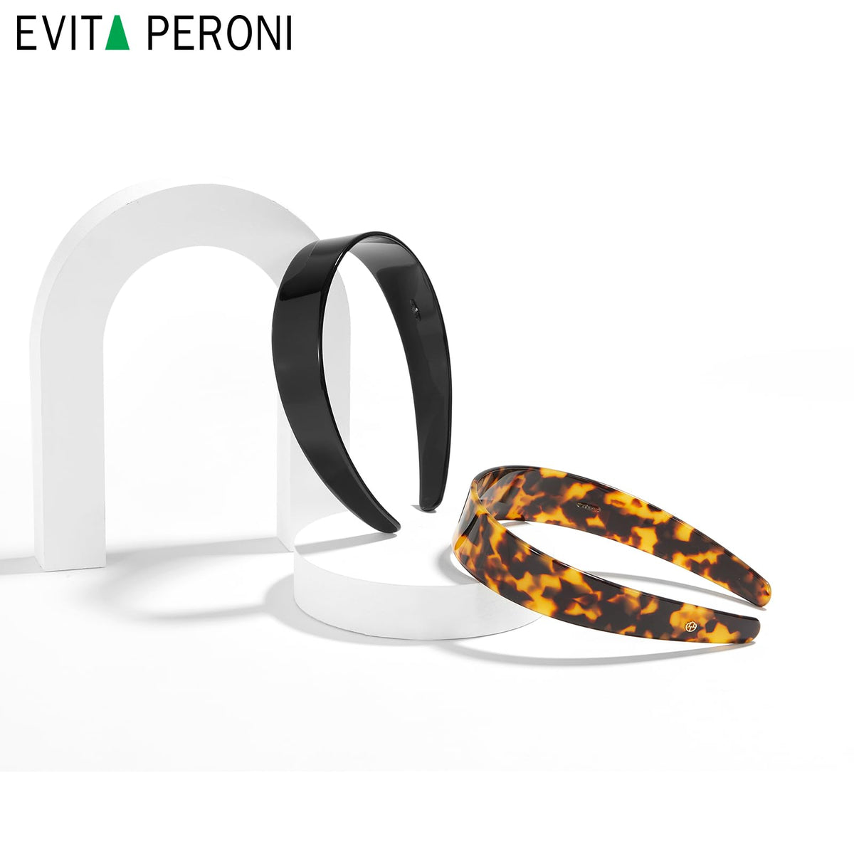 EVITA PERONI hand-held size comparison showing practical scale and fit