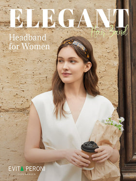 EVITA PERONI headband on hand to show scale and lightweight feel for easy carrying