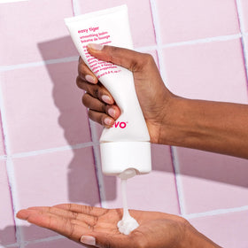 EVO being applied to damp hair, shows frizz control benefit