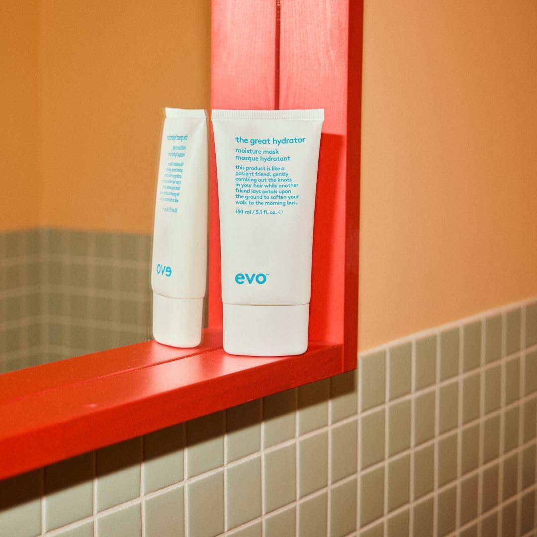 EVO on a bathroom vanity styled with towels showing salon-level care at home