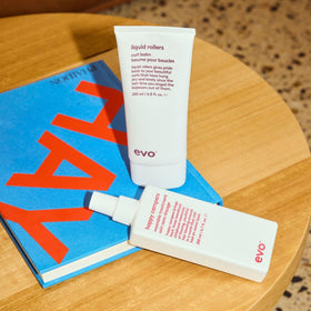 EVO Happy Campers next to hand for scale showing the 200ml travel‑friendly size