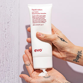 EVO bottle next to a ruler showing 6.8 fl oz size for scale