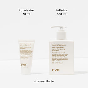EVO conditioner being applied in shower to wet hair for scalp stimulation and rinseability