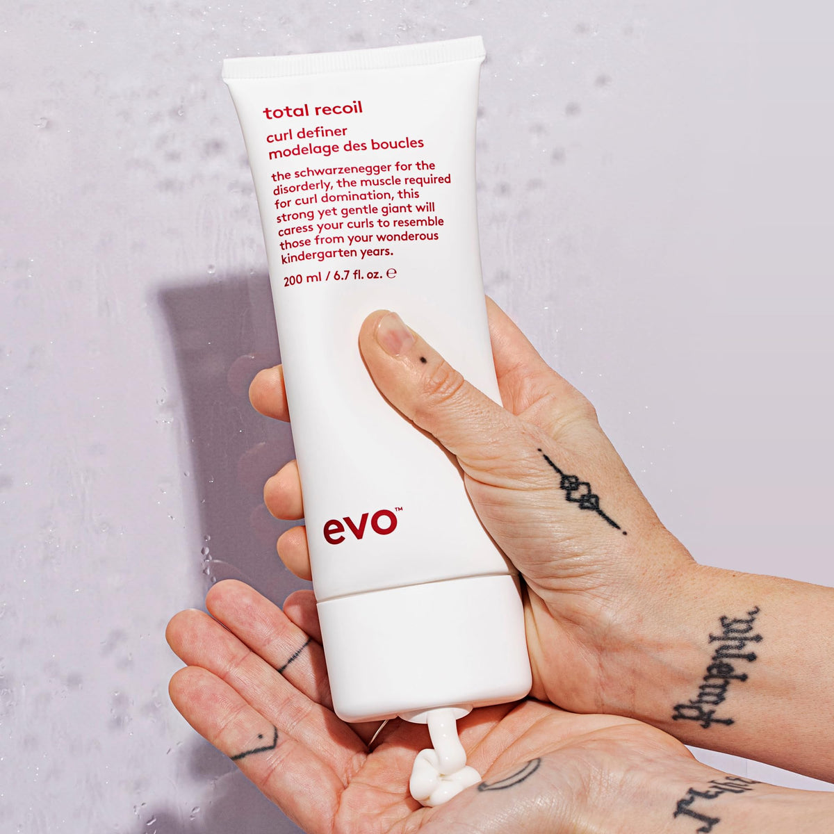 EVO tube next to common items to show 6.8 fl oz scale advantage