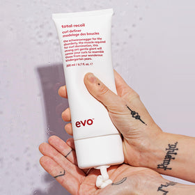 EVO tube next to common items to show 6.8 fl oz scale advantage