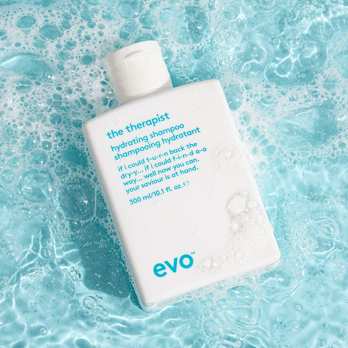 EVO shampoo in hand demonstrating easy application and slip benefit