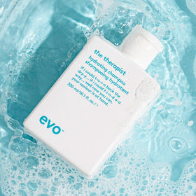 EVO bottle next to ruler showing 10.1 fl oz size and travel-friendly benefit