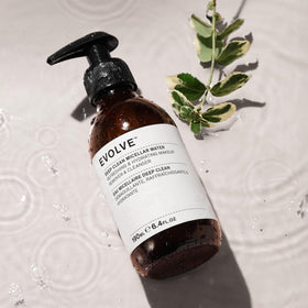 Evolve Organic Beauty removing makeup from skin with cotton pad for gentle cleansing