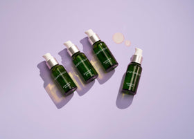 EXUVIANCE drops on hand demonstrating lightweight absorbent texture benefit