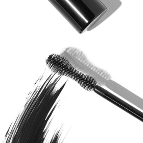 Eyeko guitar-shaped brush close-up highlighting precise lash grip