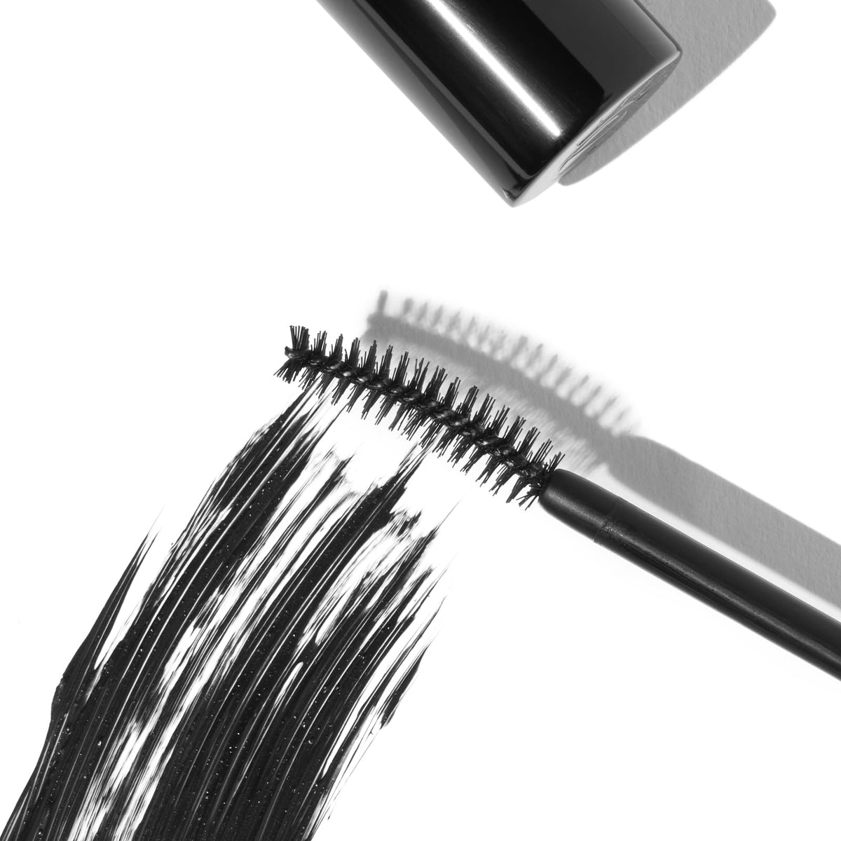 Eyeko wand and bristles close-up showing curved brush for lift and separation