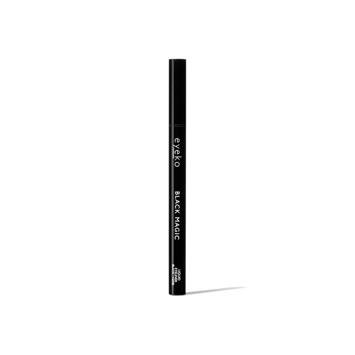 Eyeko in a makeup bag flatlay, ideal for travel-ready long-wear looks benefit