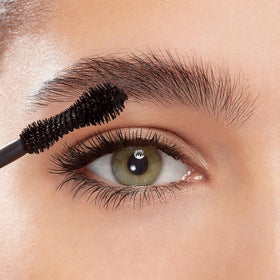 Eyeko mascara applied on eye demonstrating lifted curled lashes