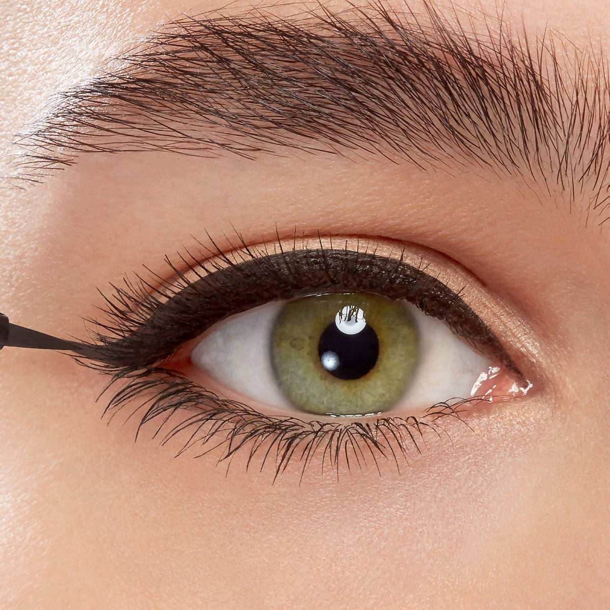 Eyeko open cap revealing brush detail, easy one-stroke application benefit