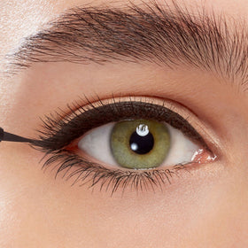 Eyeko open cap revealing brush detail, easy one-stroke application benefit