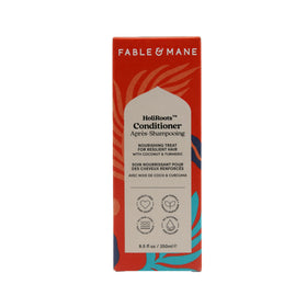 Fable & Mane bottle next to a ruler showing product size and travel-friendly benefit