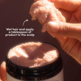 Fable & Mane scrub being applied in shower demonstrating cleansing action