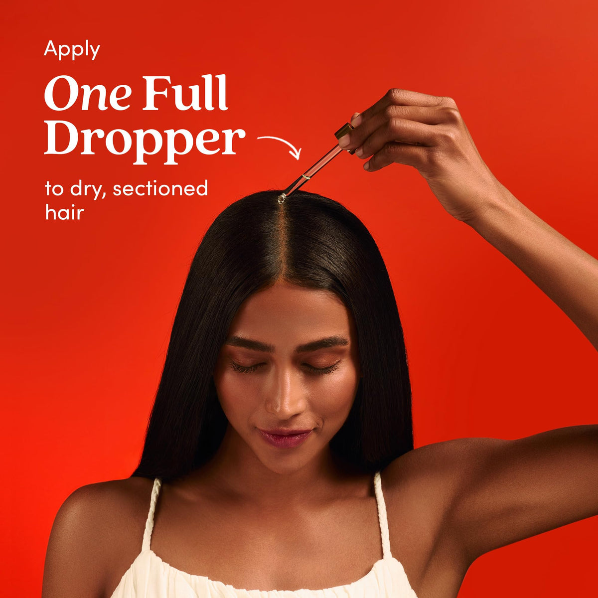 Fable & Mane applied to scalp in fingertips for targeted root nourishment benefit