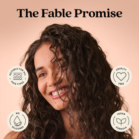fable & mane bottle held for size comparison conveying travel-friendly volume