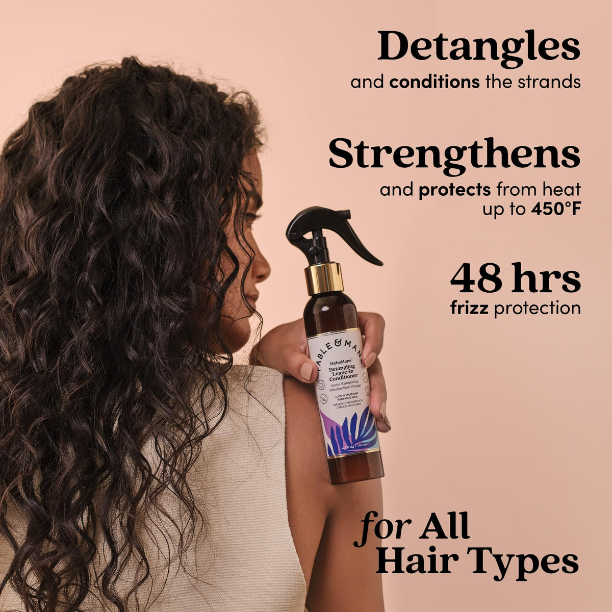 Hand spraying Fable & Mane detangler demonstrating easy application