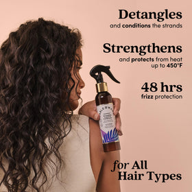 Hand spraying Fable & Mane detangler demonstrating easy application