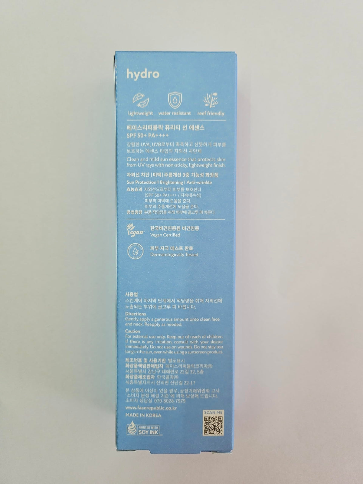 Face Republic bottle on beach towel illustrating water-resistant use