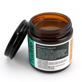 Fadelo open jar revealing unrefined Batana Oil texture and purity benefit