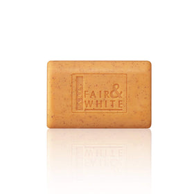 FAIR & WHITE soap beside carrot and apricot stones showing natural actives