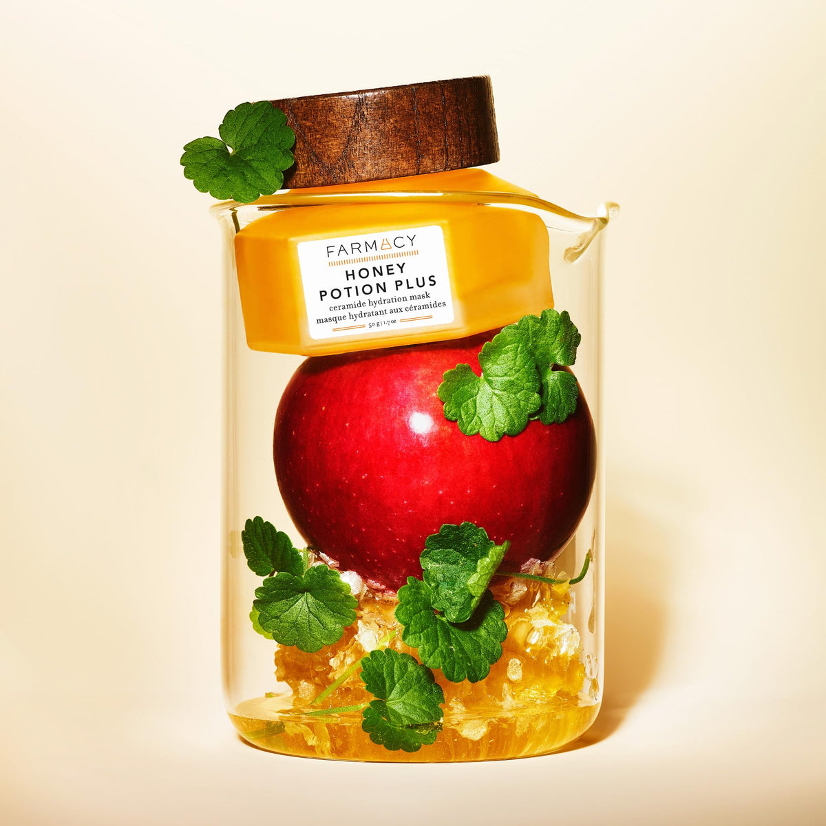Farmacy ingredients flatlay with honey, apple extract, and ceramides emphasizing natural actives