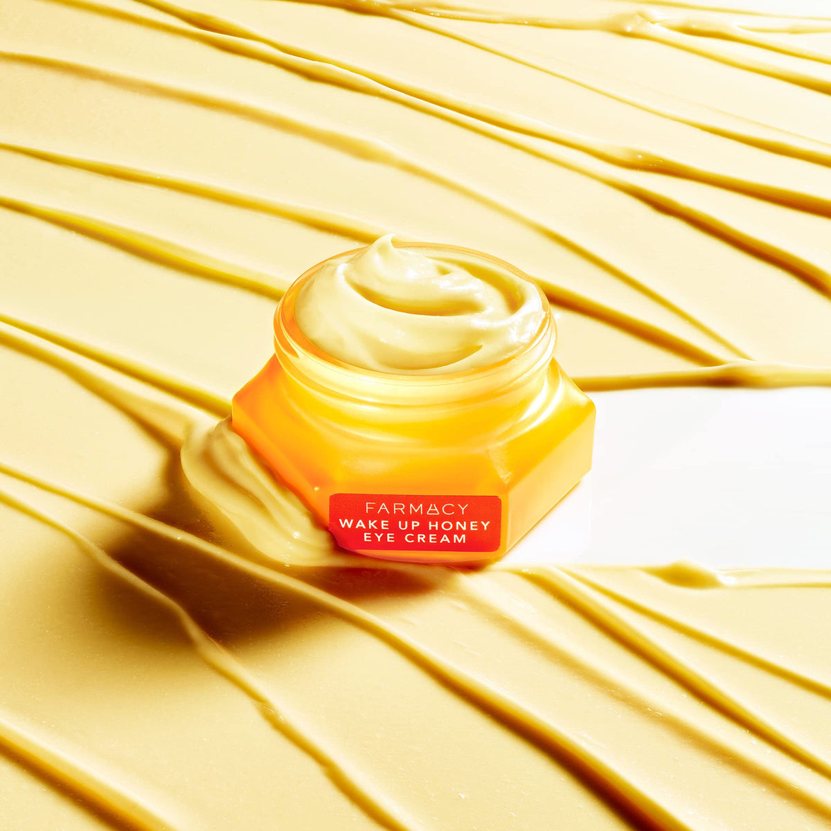 Farmacy cream texture swirl displaying silky honey consistency