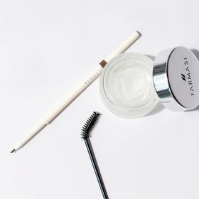 FARMASi tube held in hand illustrating 0.88 oz size and portability