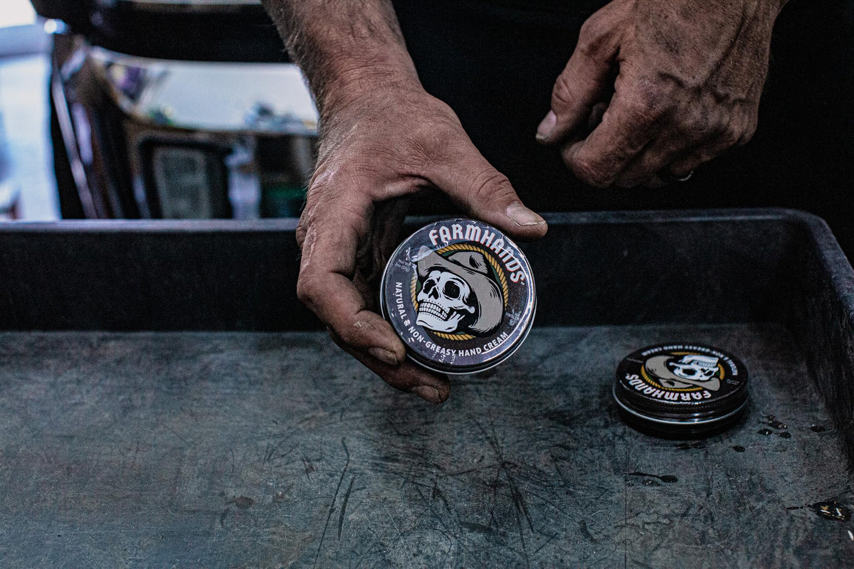 Farmhands tin next to tools showing work-ready protection and practicality