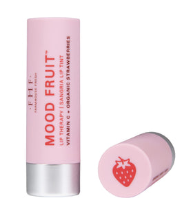 FarmHouse Fresh balm applied on lips showing sheer sangria-pink tint and hydrated finish