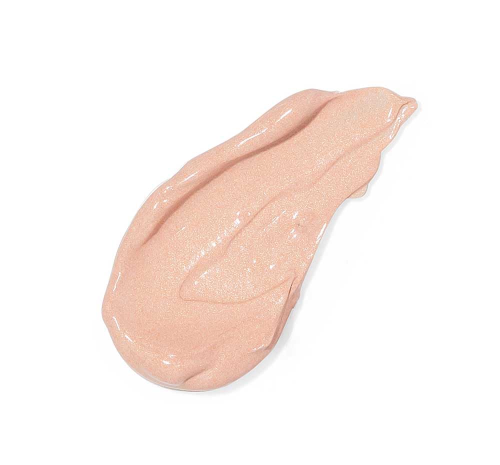FarmHouse Fresh applying peachy-nude cream under eye for instant brightening benefit