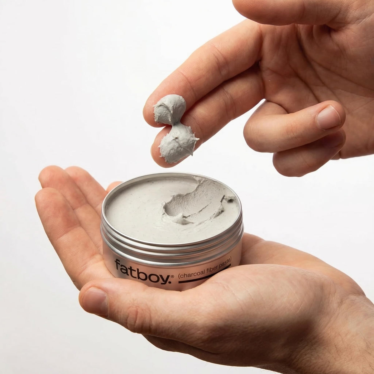 Fatboy Hair paste texture in hand demonstrating dry fibers and oil-absorbing benefit