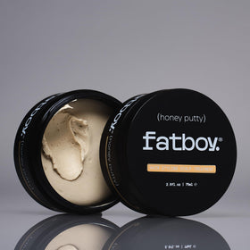 Fatboy Honey Putty beside a 2.6 oz reference demonstrating compact travel size