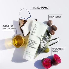 FEKKAI glossing cream being applied to damp hair to tame frizz and add shine