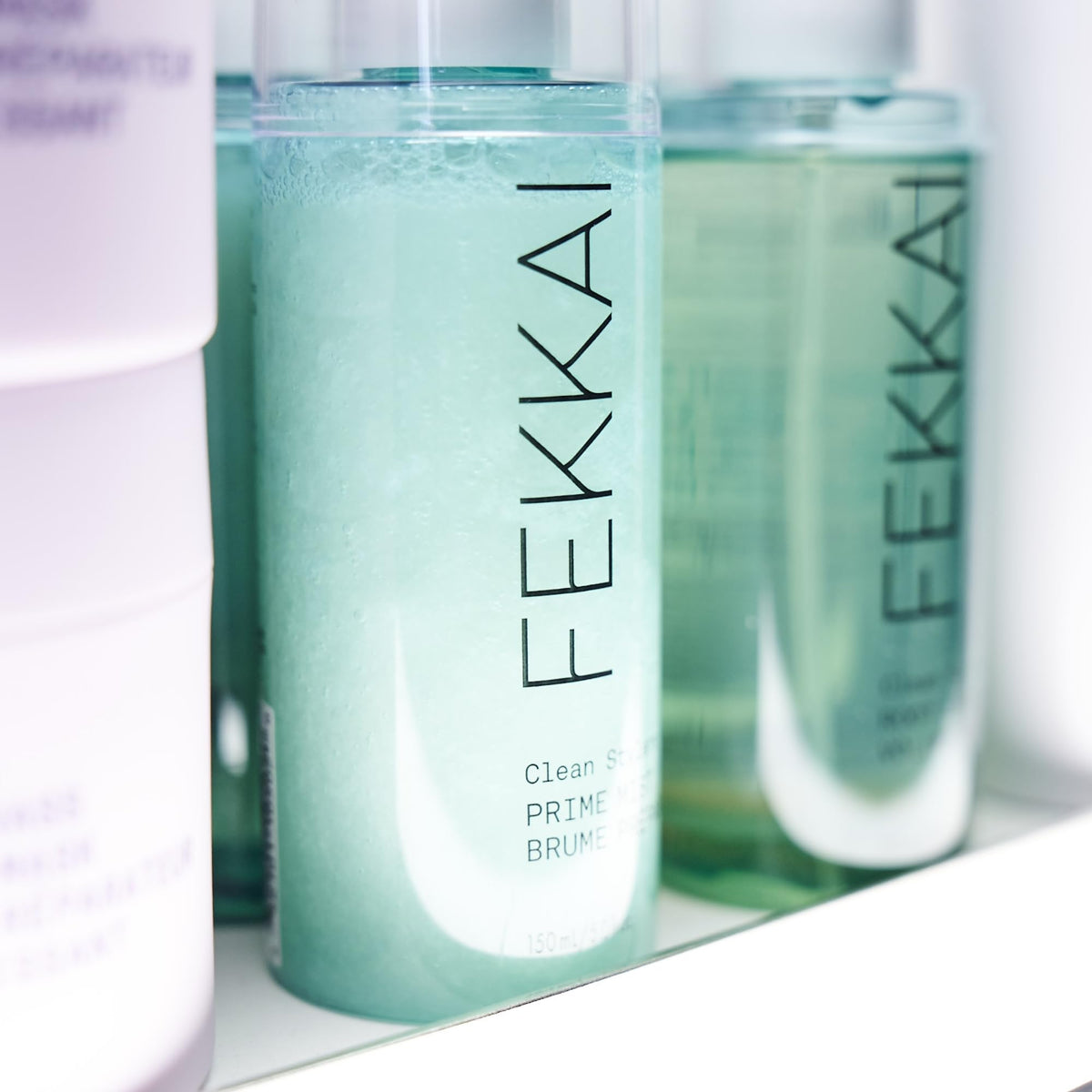 Fekkai prime mist in use during blowdry demonstrating heat protection and frizz control