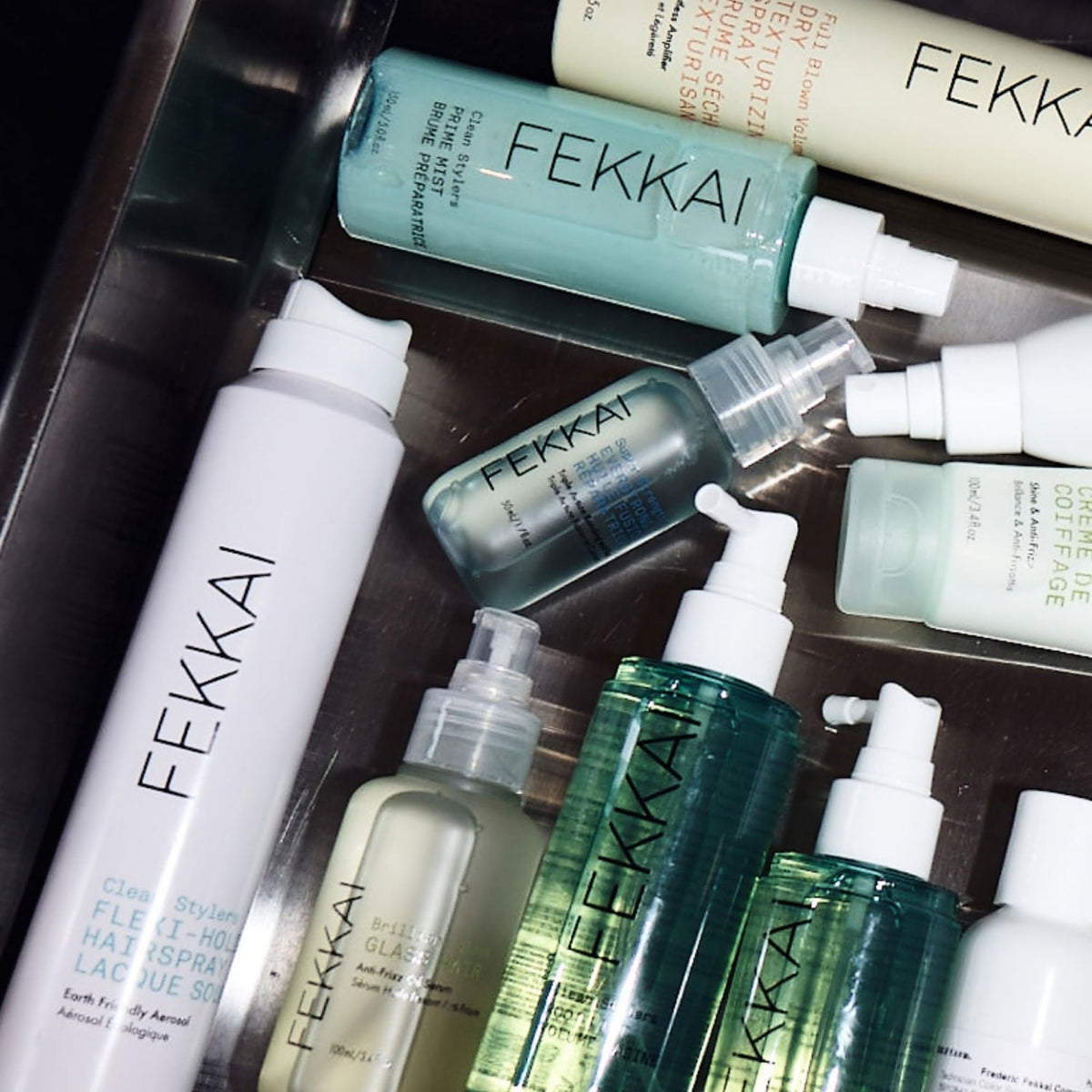 Fekkai prime mist nozzle closeup illustrating fine micro-mist for even product distribution