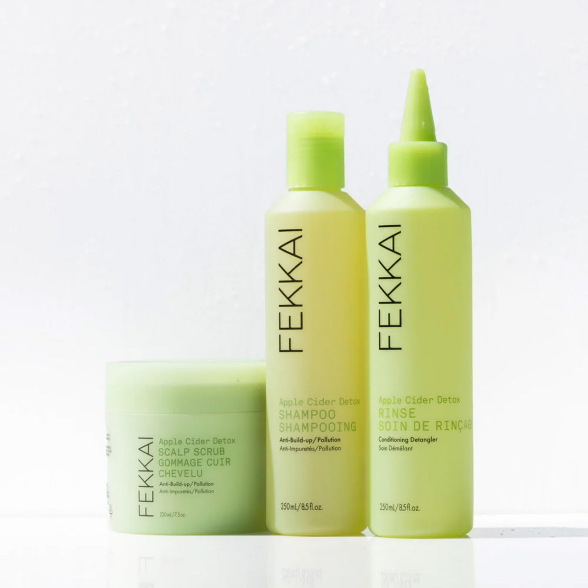 Fekkai rinsing in shower illustrating clarifying action and refreshed scalp
