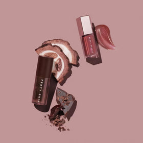 FENTY BEAUTY duo held in hand to show compact size and travel-friendly convenience