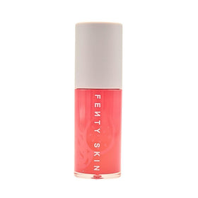 FENTY BEAUTY oil texture drop on hand highlighting lightweight, non-sticky hydration