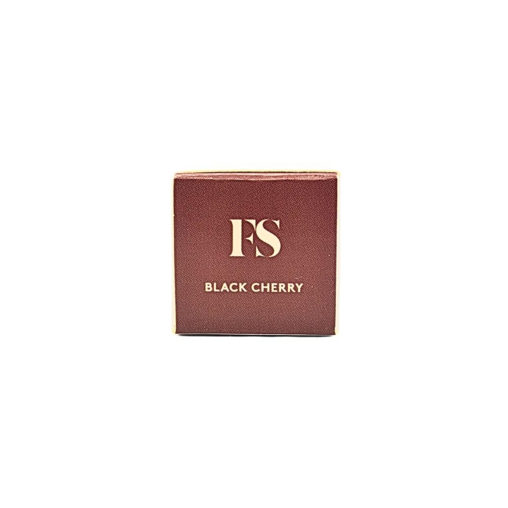 FENTY BEAUTY lip oil next to coin to show size and travel-friendly convenience