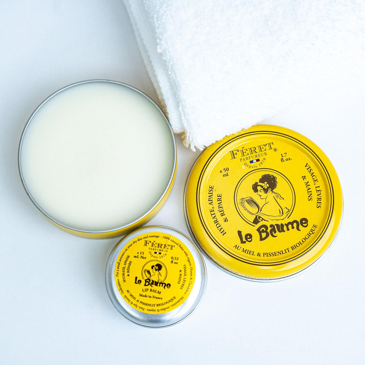 Feret Parfumeur tin next to a coin displaying size and travel-friendly convenience benefit