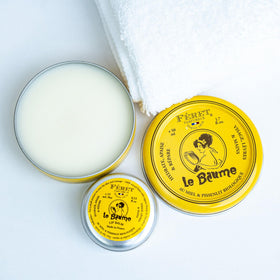Feret Parfumeur tin next to a coin displaying size and travel-friendly convenience benefit
