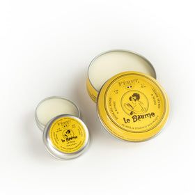 Feret Parfumeur tin open beside coin for scale showing pocket-sized portability